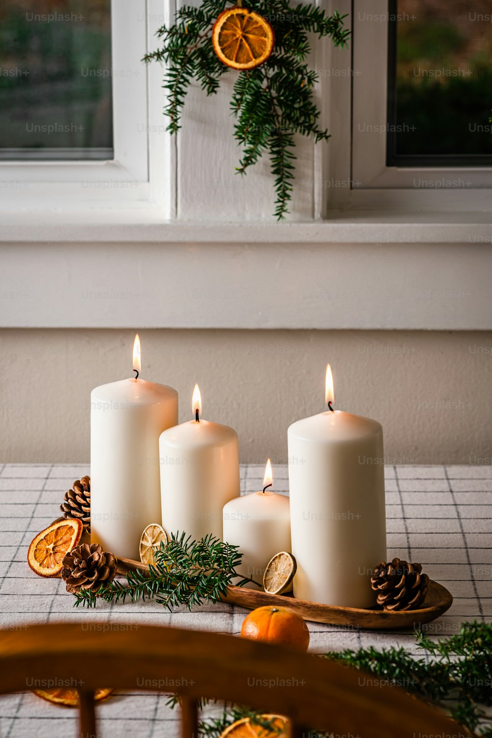 a group of white candles sitting on top of a table