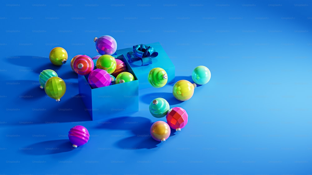 a blue box filled with lots of colorful balls