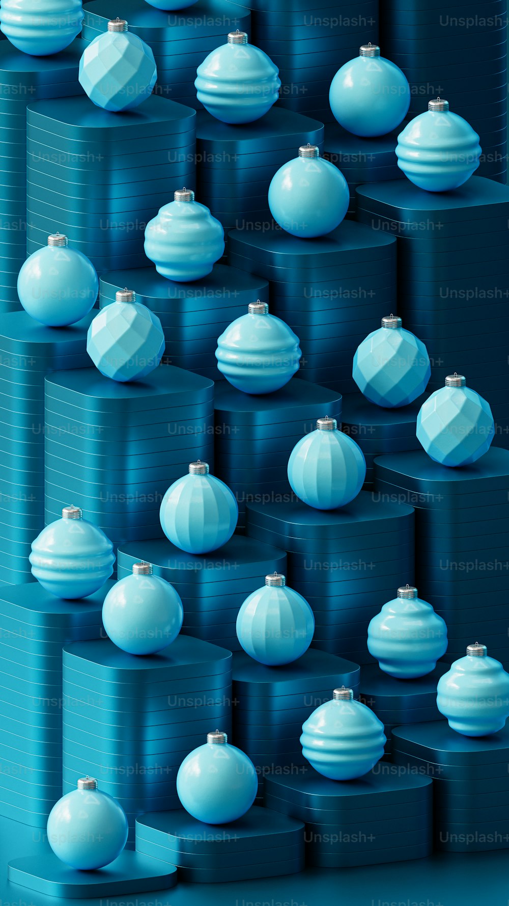 a bunch of blue and white ornaments are stacked on top of each other