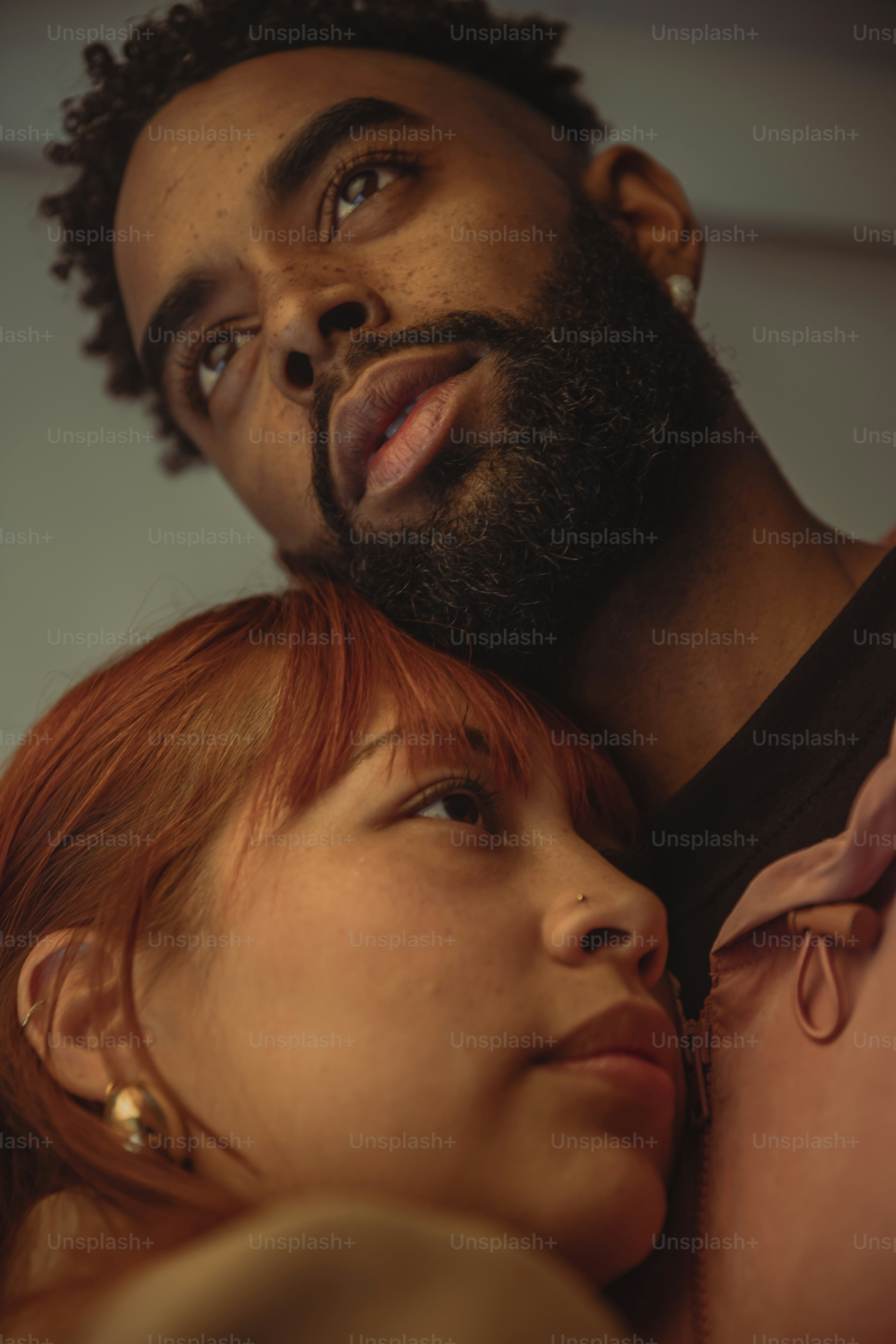 a close up of a person hugging a woman