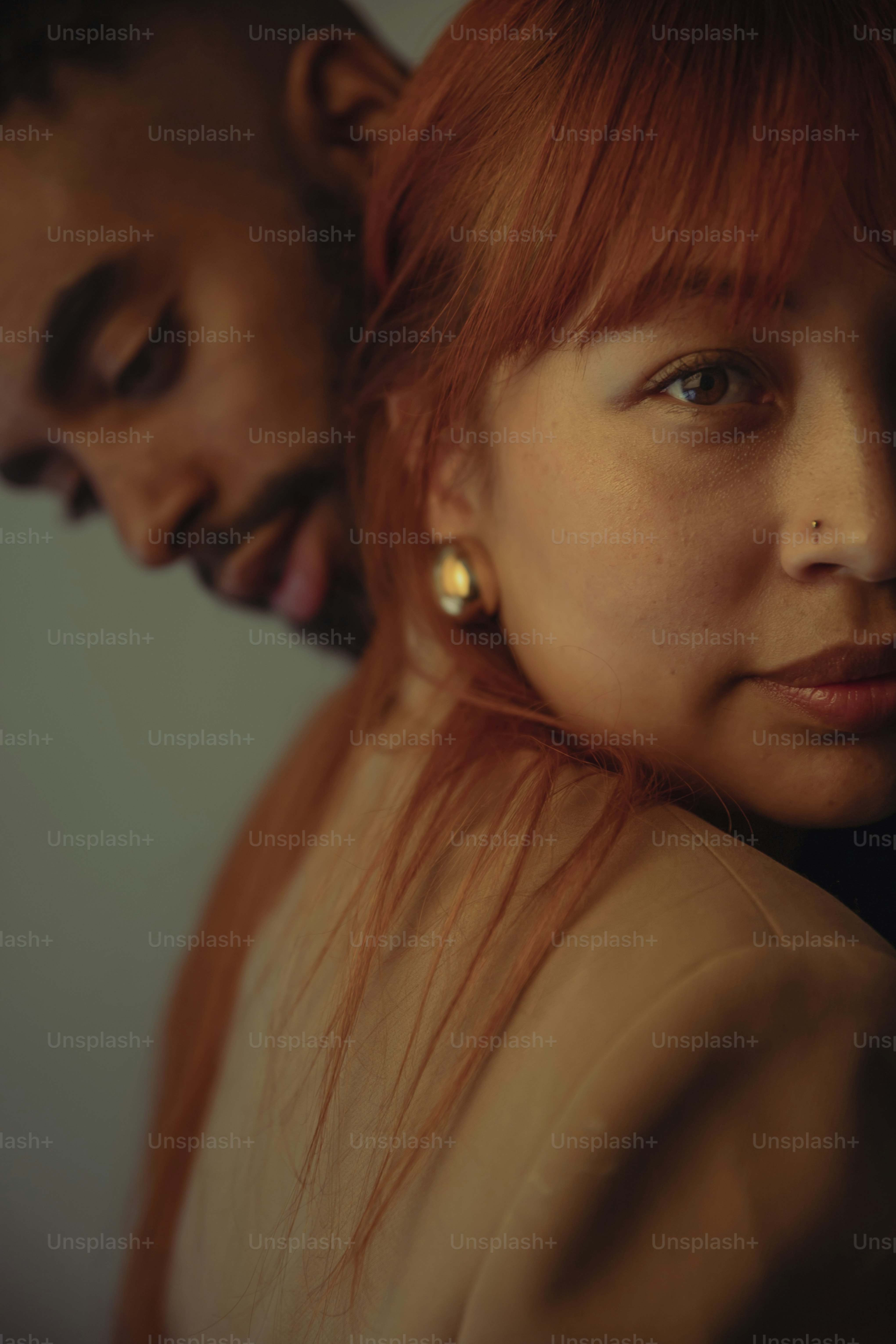 a man and a woman with red hair