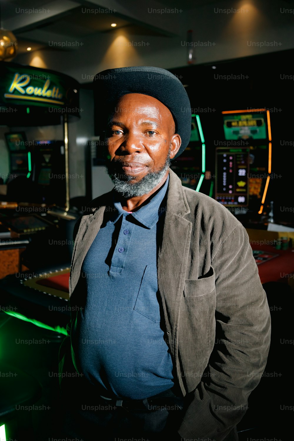 a man standing in front of a casino machine