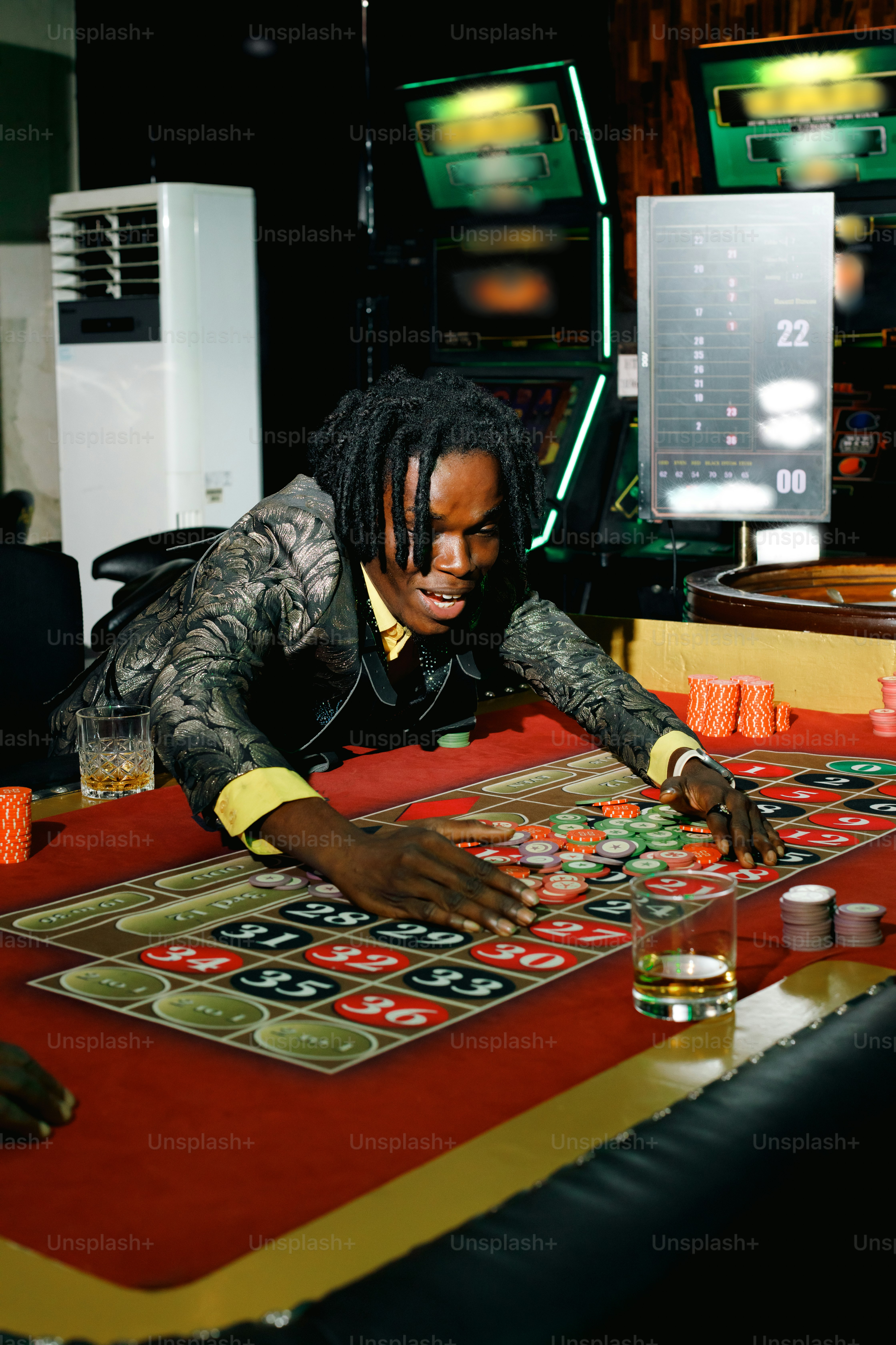 A group of people playing a board game photo – Gambling Image on Unsplash