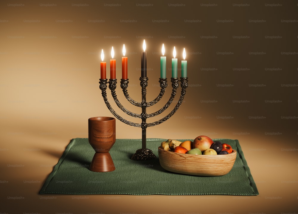 a hanukkah menorah with fruit and a bowl of fruit