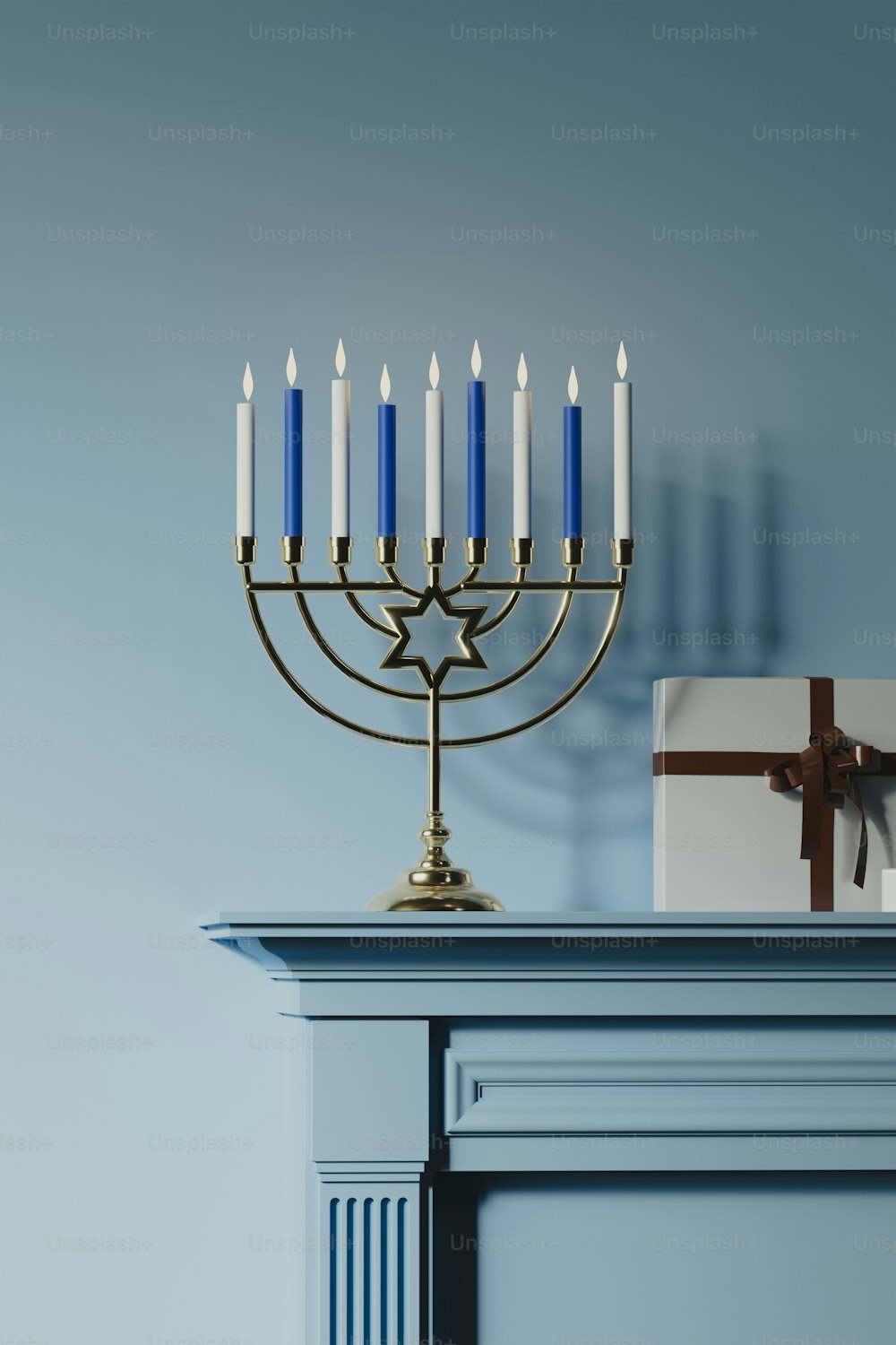 a lit menorah sitting on top of a mantle