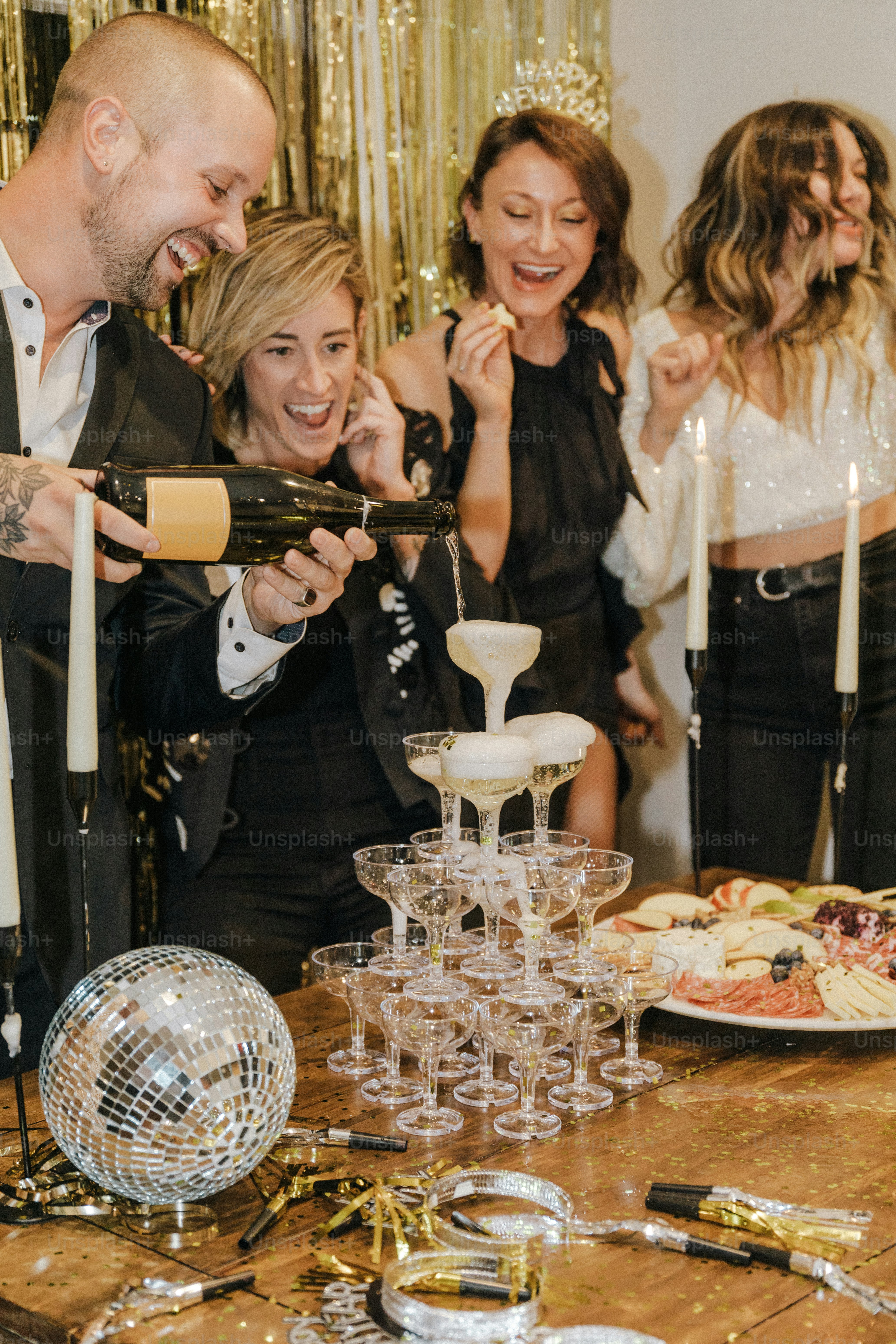 a group of people standing around a table