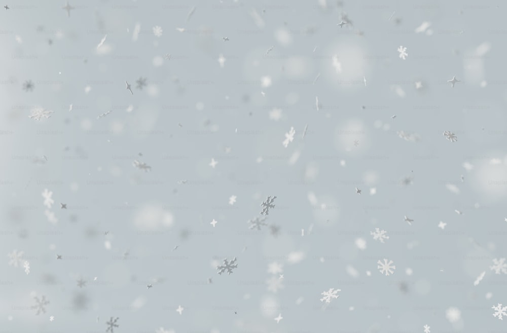 snow flakes are falling down on a gray background