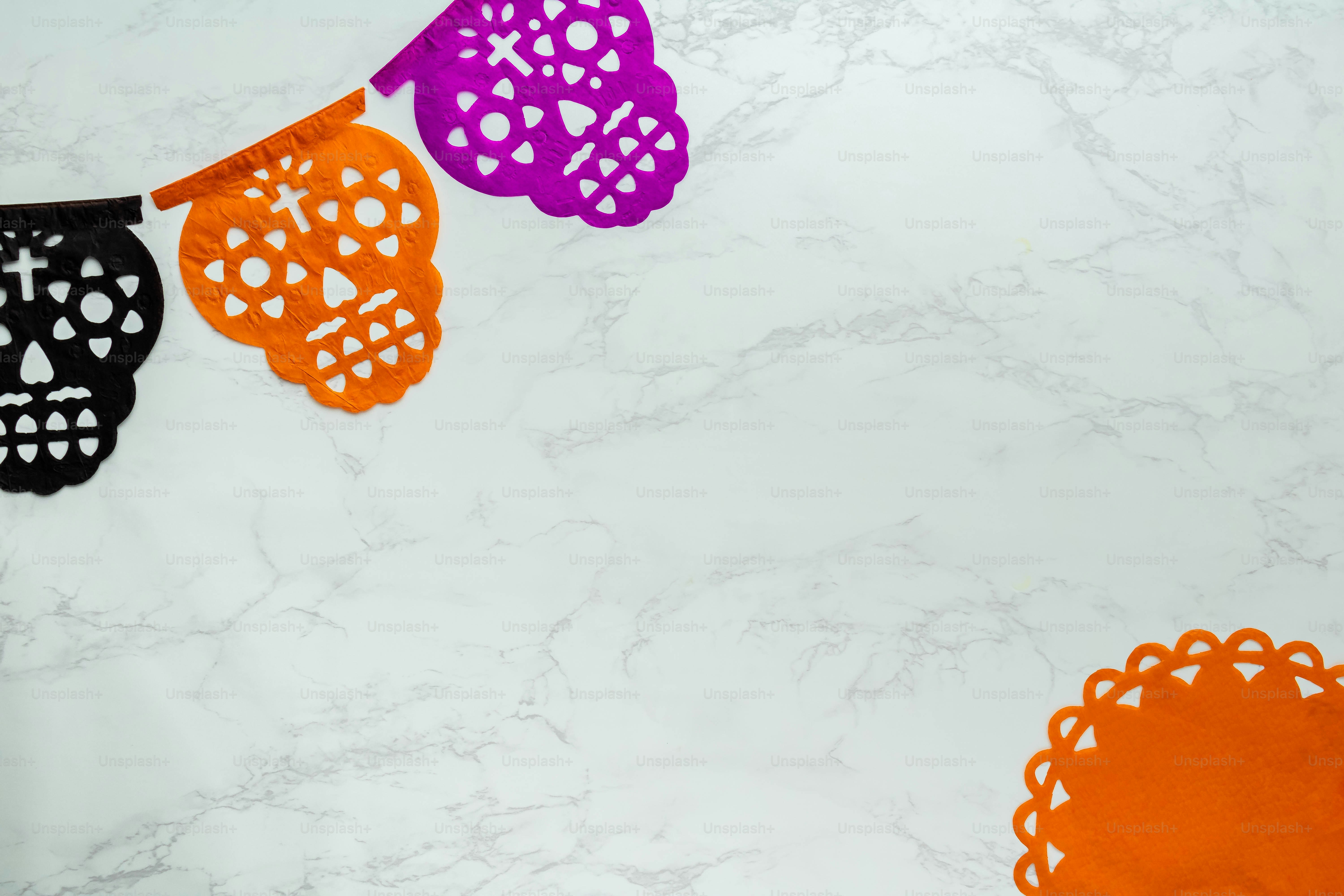 a white marble counter top with halloween decorations on it