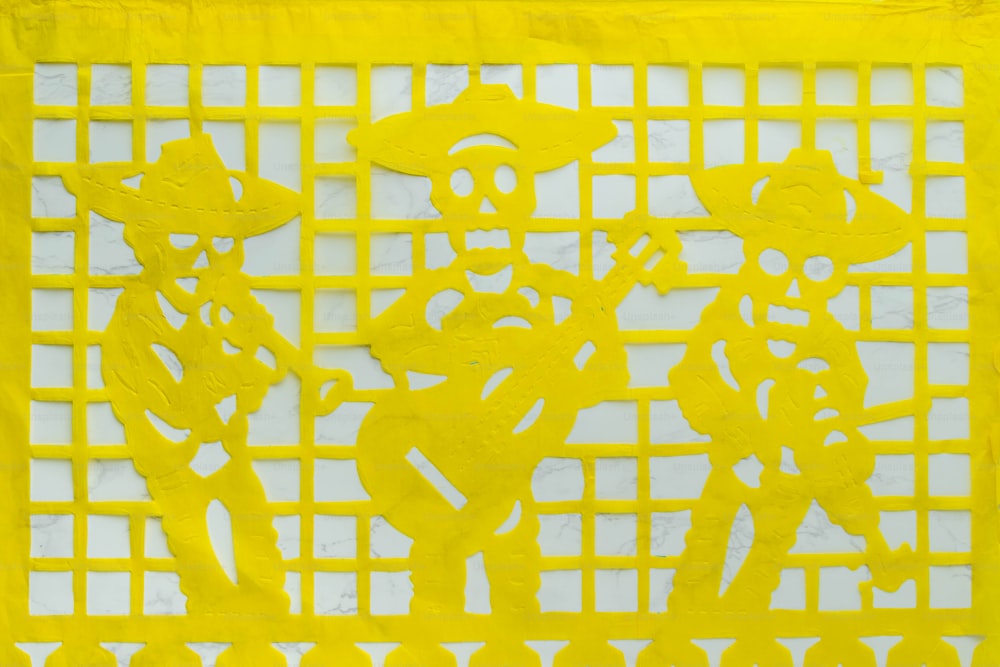 a yellow piece of paper with a design on it