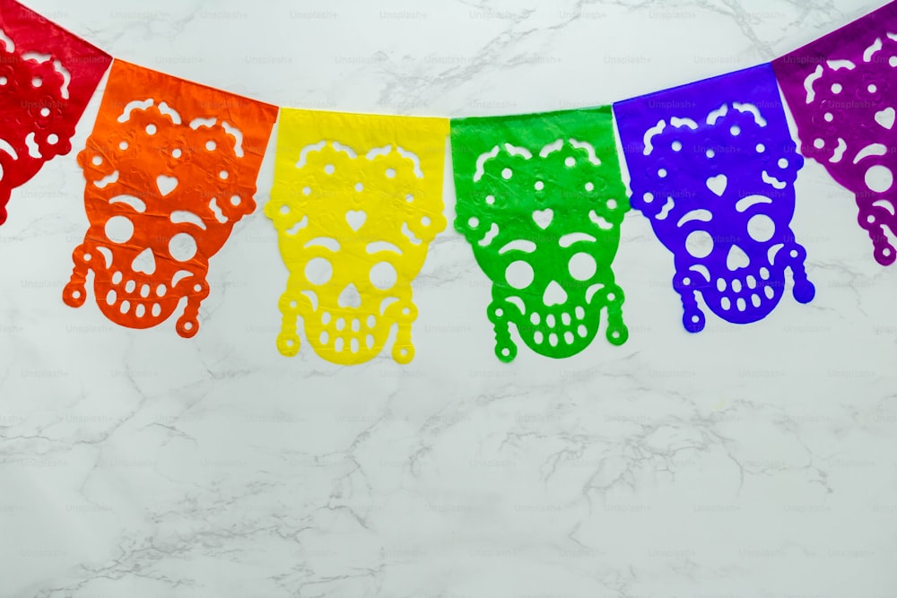 a colorful day of the dead banner on a marble background