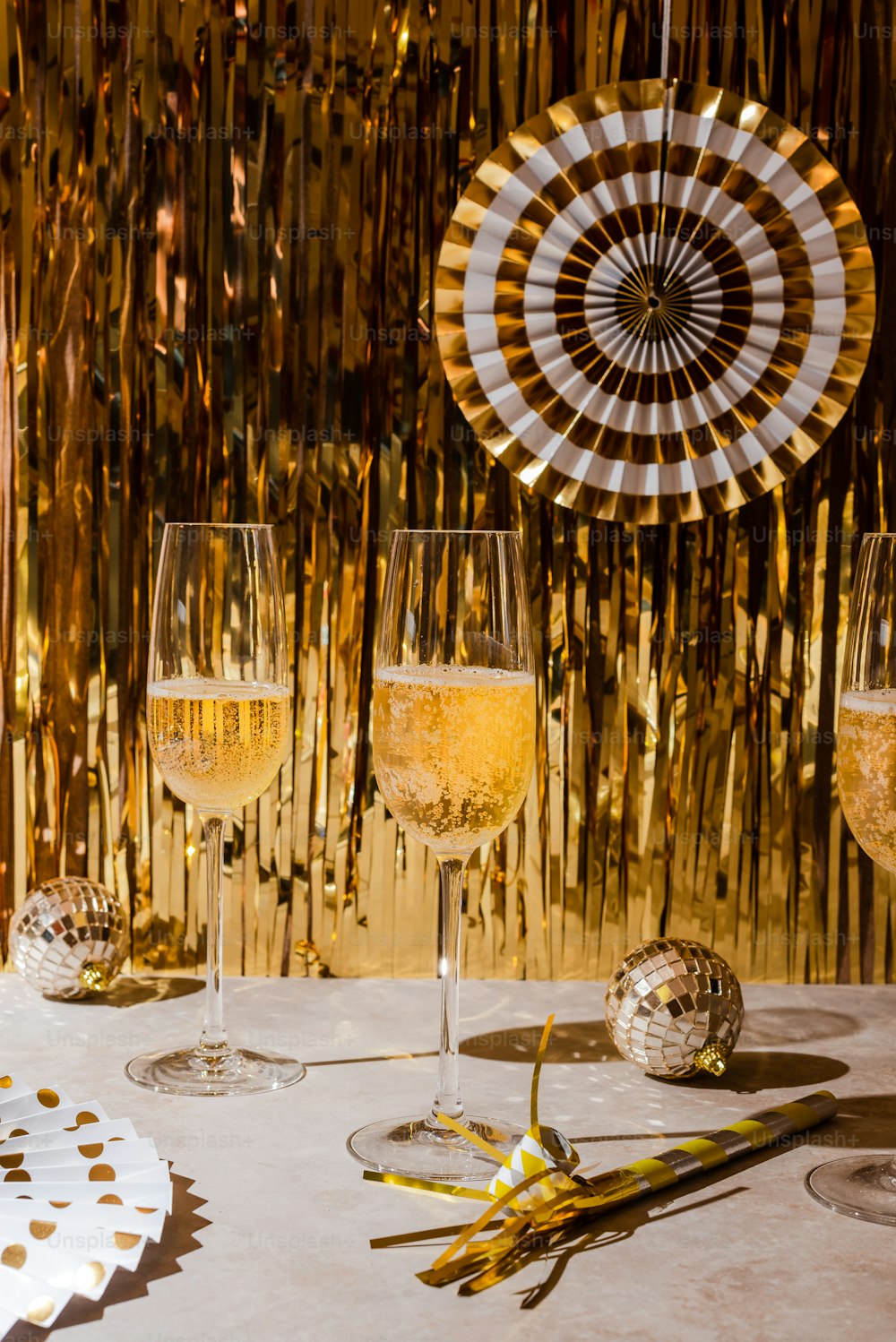 a table topped with wine glasses filled with champagne