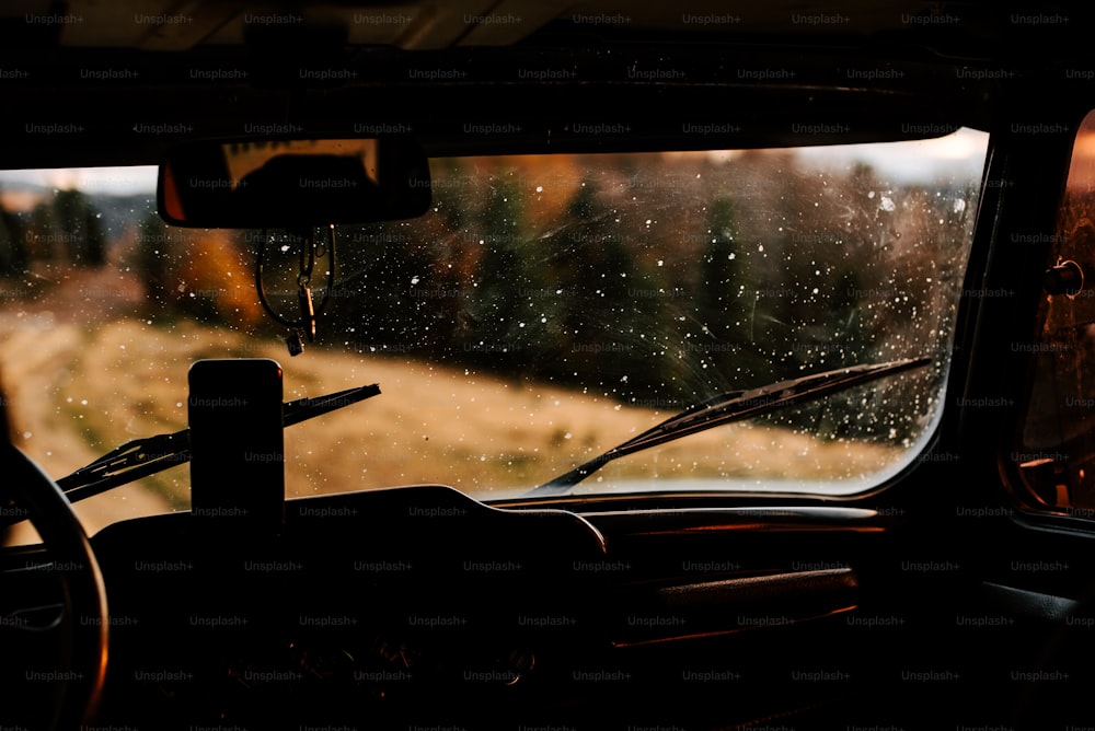 a view from inside of a vehicle looking out the window