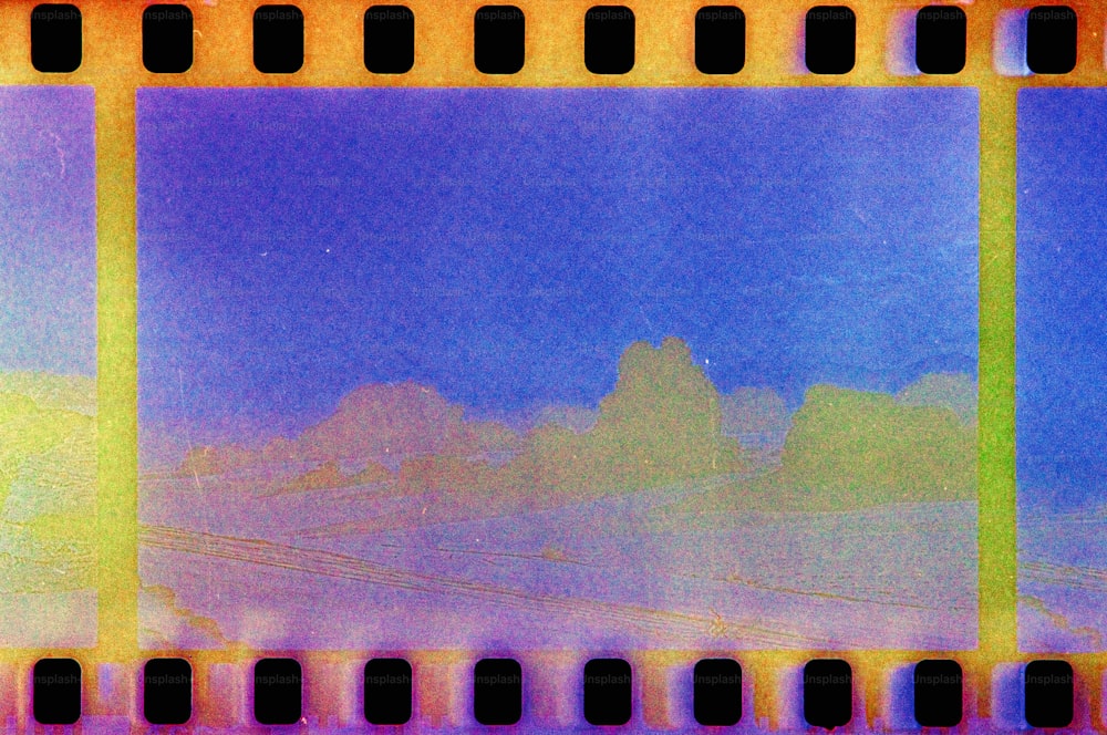 a film strip with a blue sky in the background