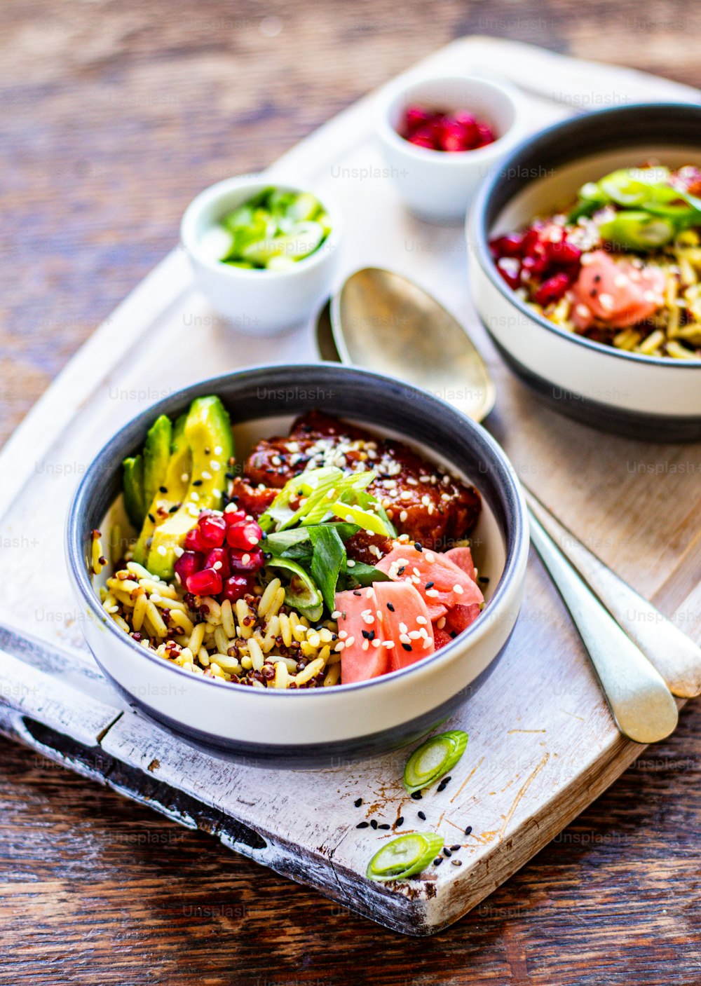 a couple of bowls of food on a tray