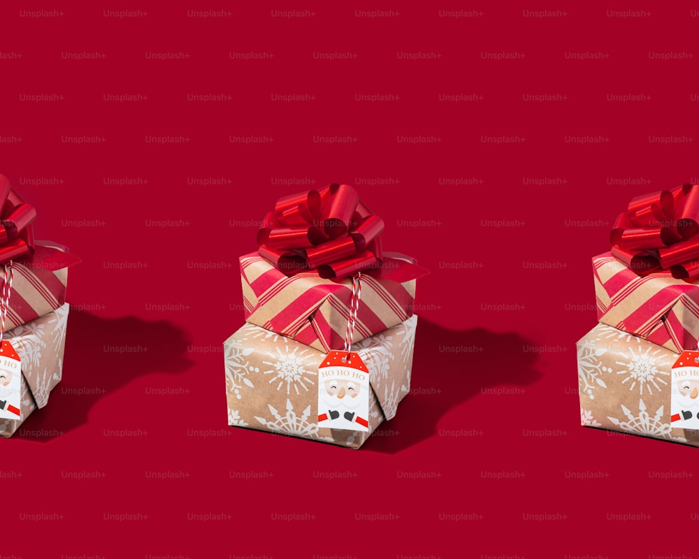 three wrapped presents on a red background