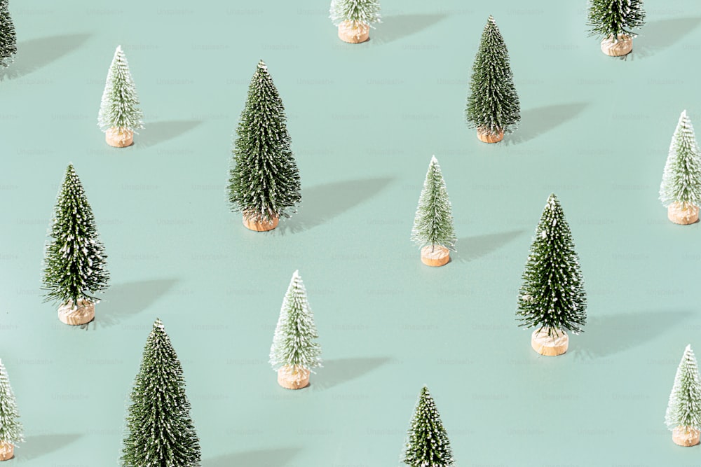 a group of small christmas trees sitting on top of a table