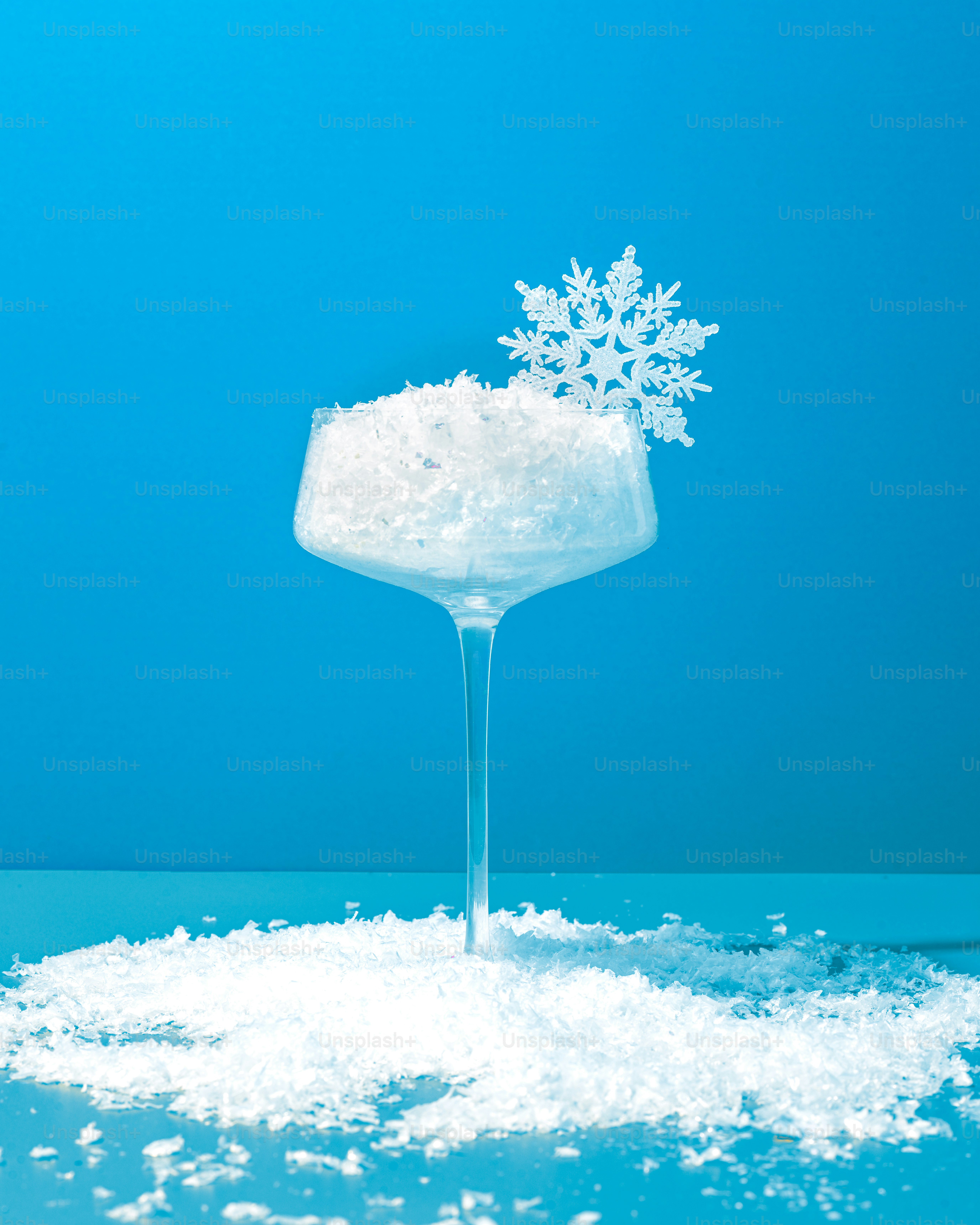 a wine glass with a snowflake on top of it