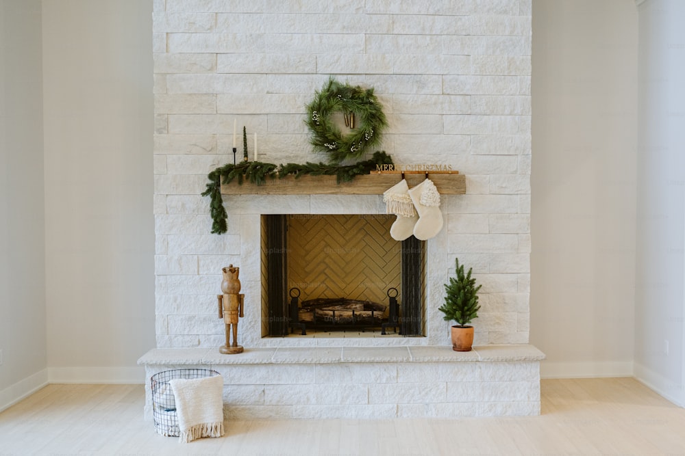 a fireplace with a wreath and stockings on it
