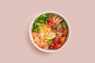 a white bowl filled with lots of different types of food