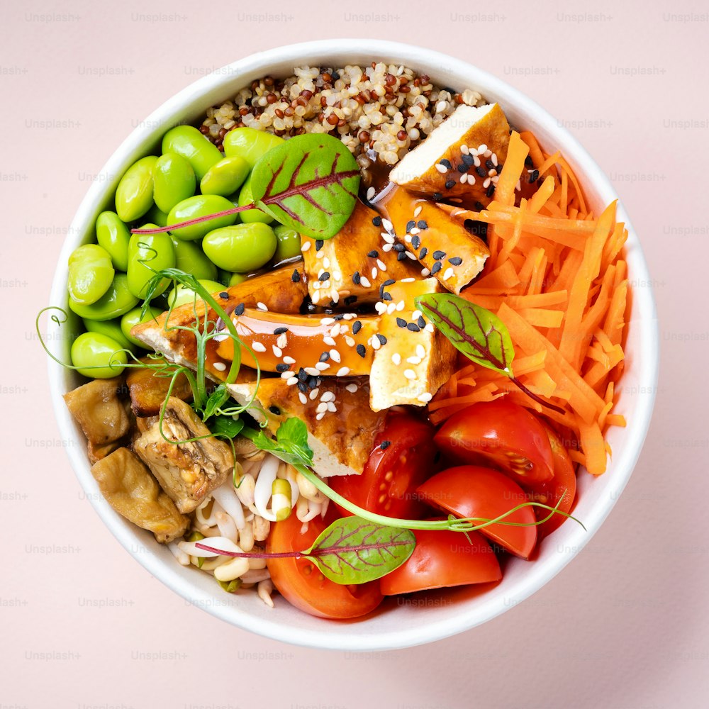 a white bowl filled with lots of different types of food