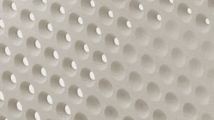 a close up of a wall with many circles on it
