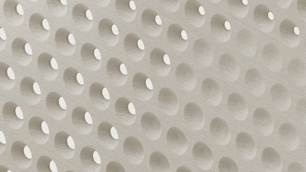 a close up of a wall with many circles on it