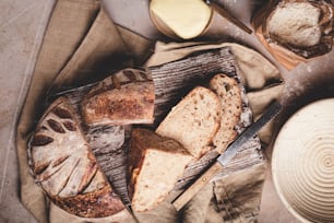 a loaf of bread sitting on top of a wooden cutting board