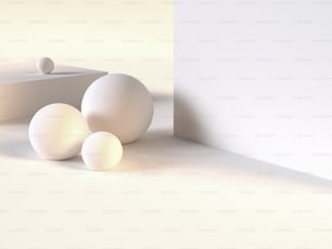 a group of three white balls sitting next to a wall