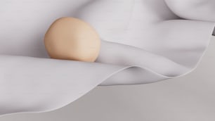 an egg is laying on a white sheet