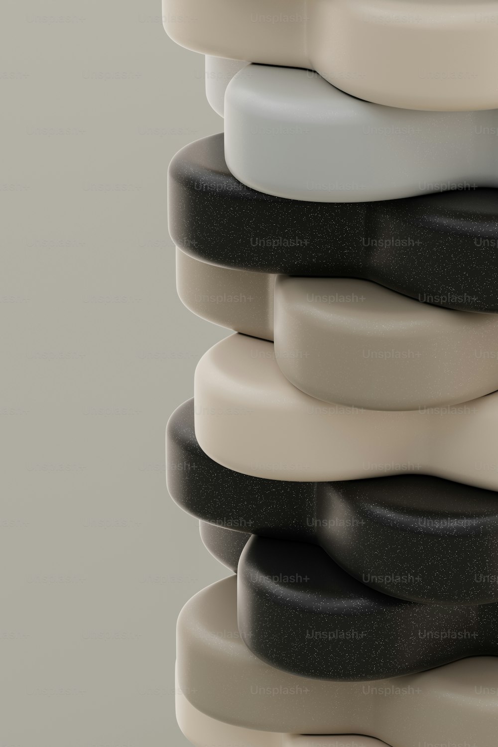 a stack of black, white, and grey objects