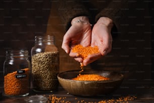 a person is sprinkling seeds into a bowl