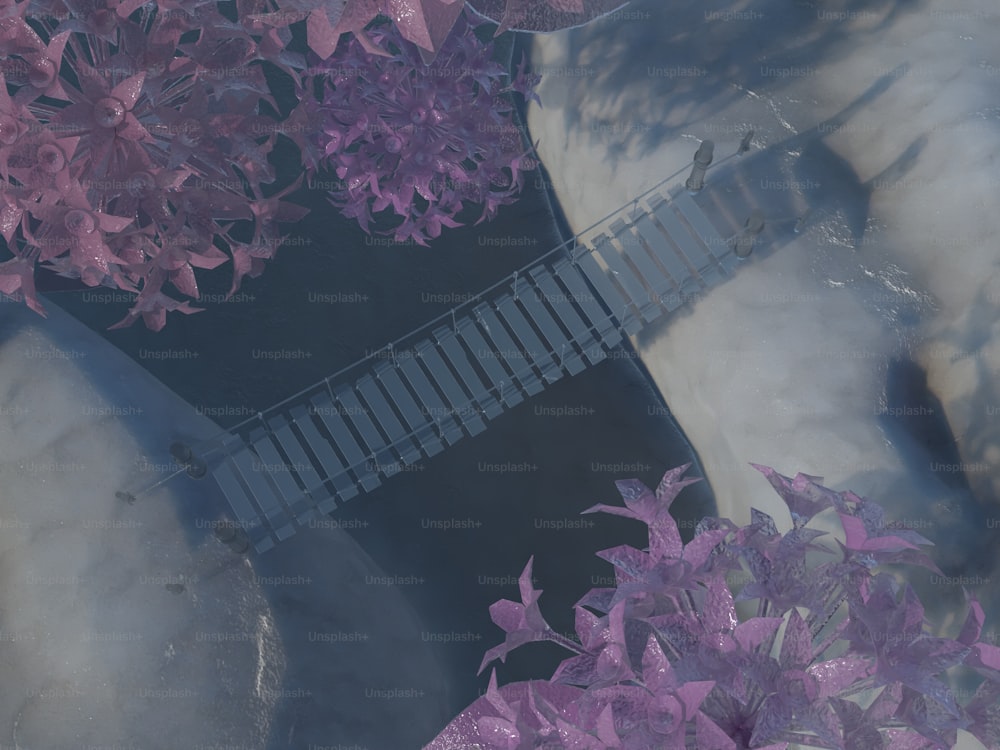 an aerial view of a bridge surrounded by purple flowers