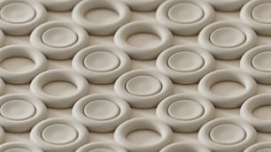 un primo piano di un muro fatto di cerchi bianchi