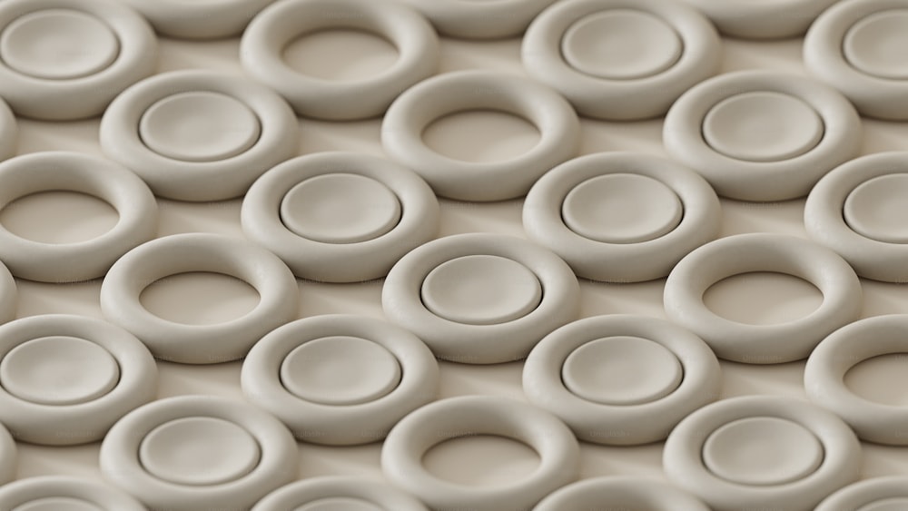 Un primer plano de una pared hecha de círculos blancos