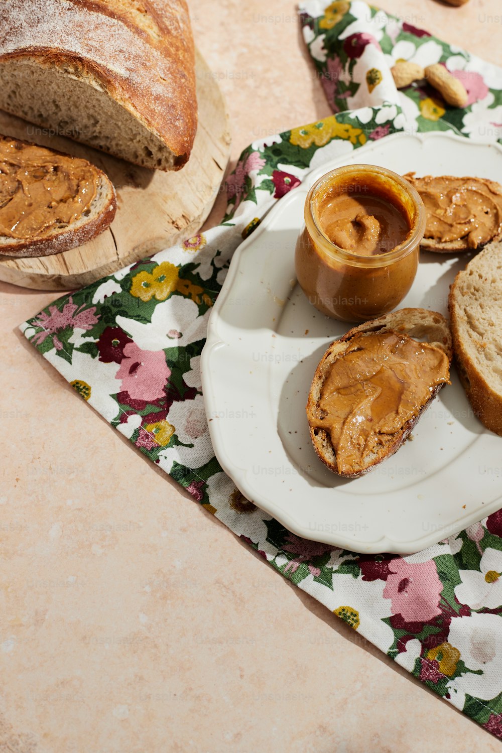 a white plate topped with bread and peanut butter