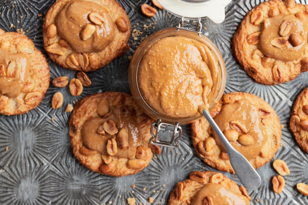 peanut butter cookies and a jar of peanut butter