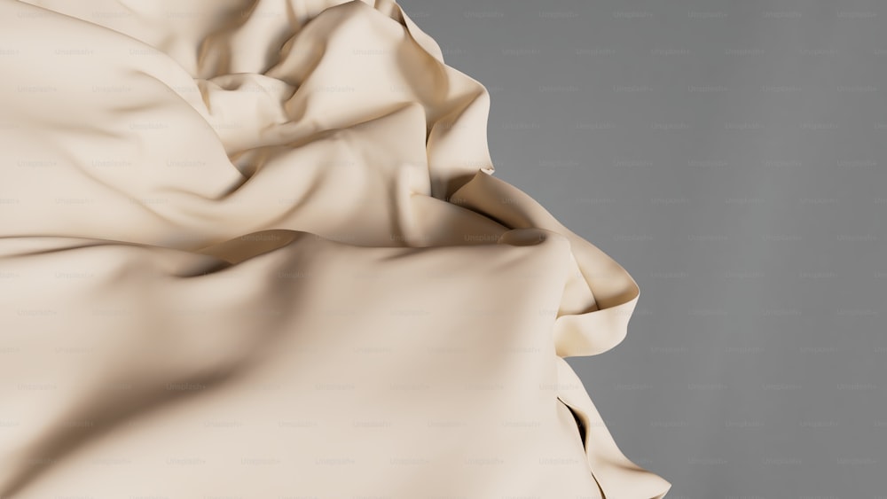 a close up of a white cloth with a gray background