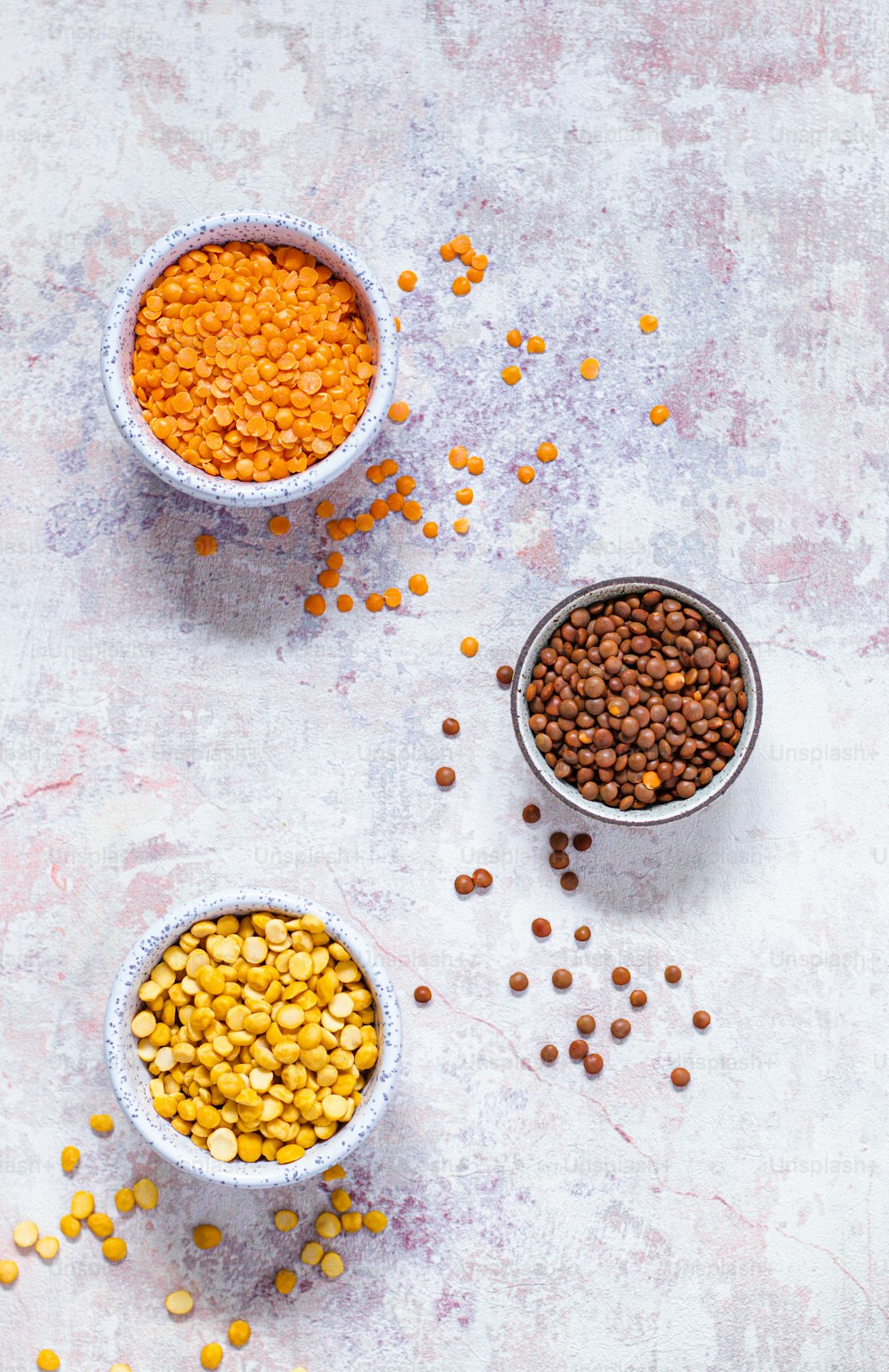 three bowls filled with different types of food