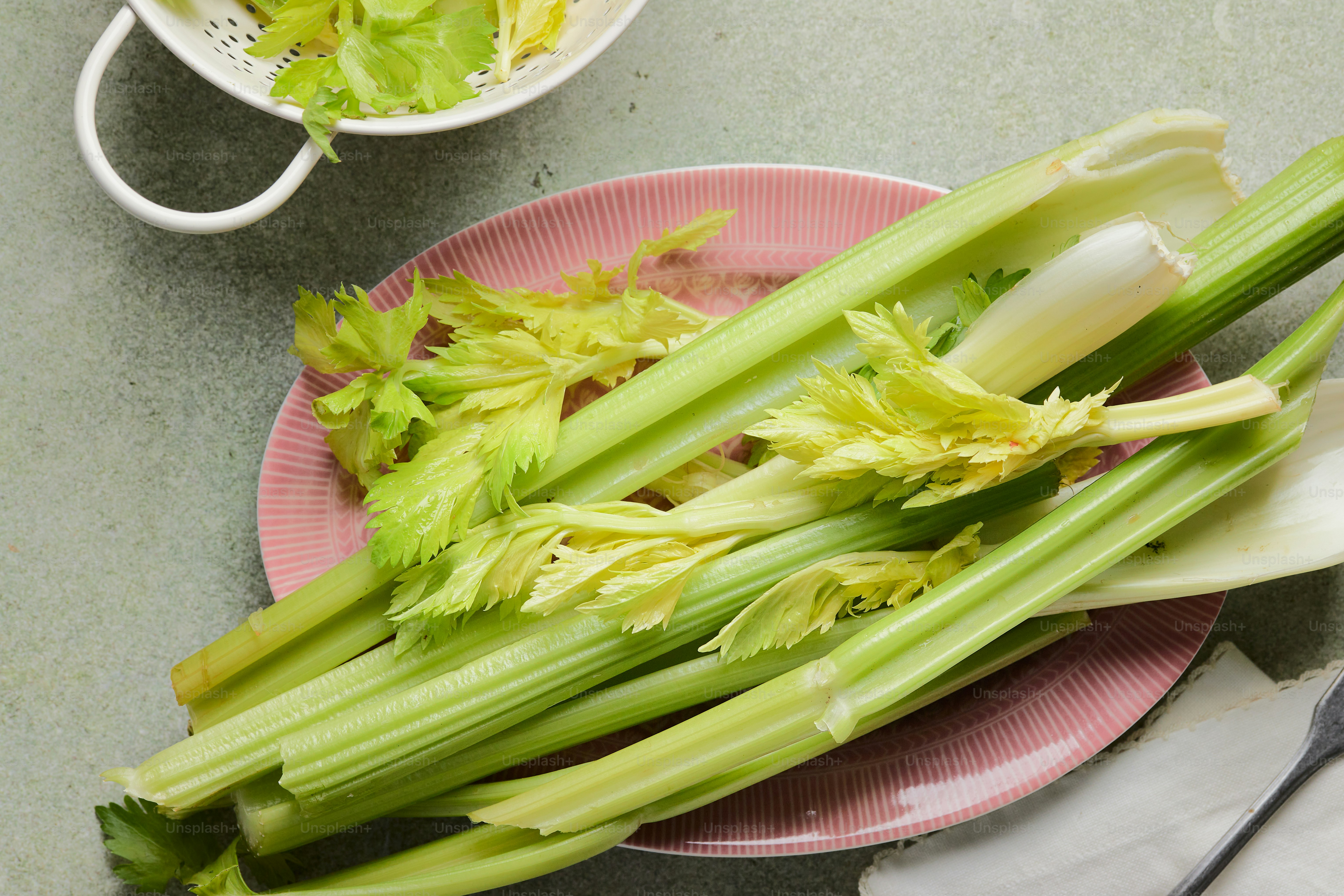a plate of celery on a table