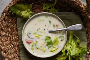 a bowl of soup with a spoon in it