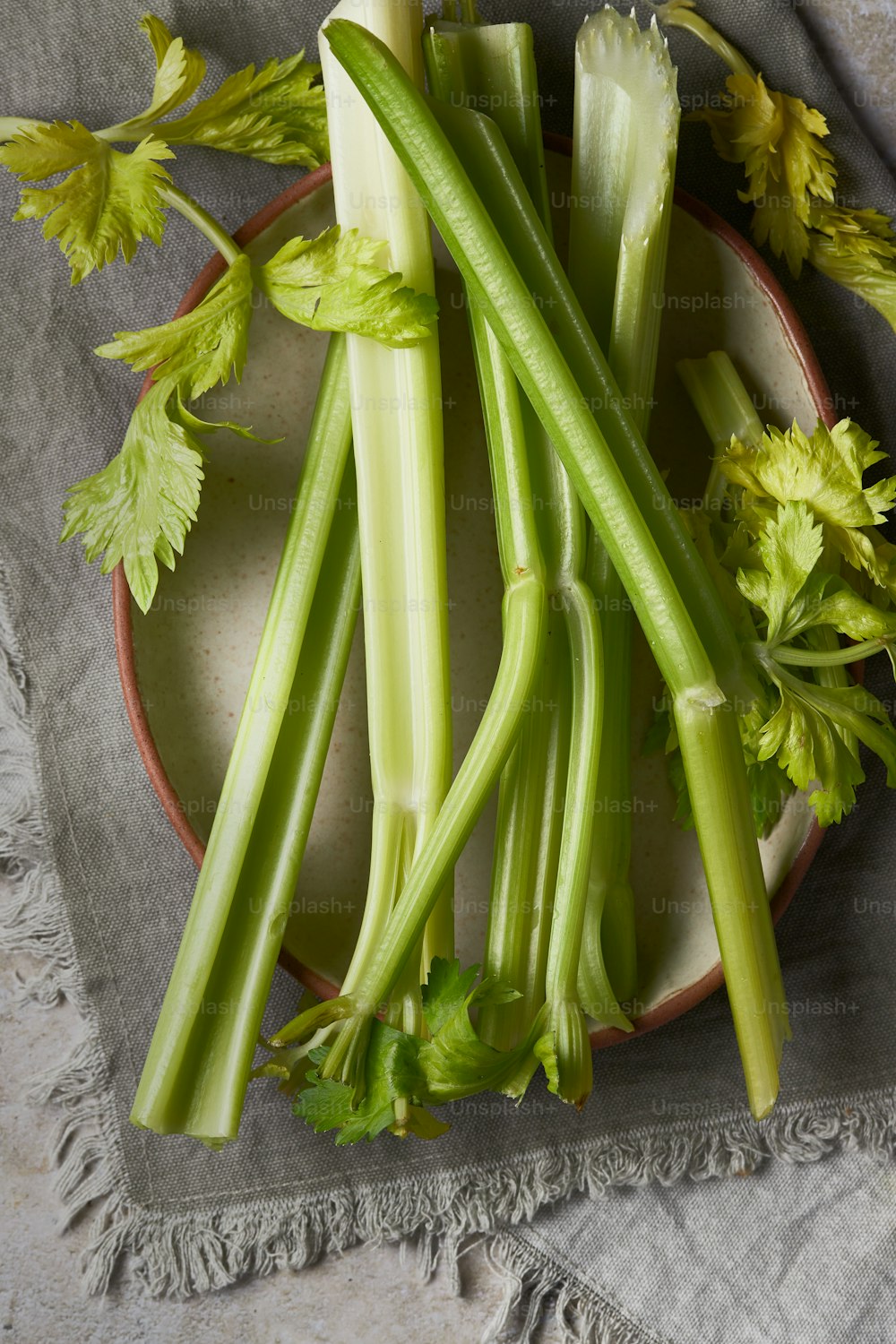 a plate of celery on a table