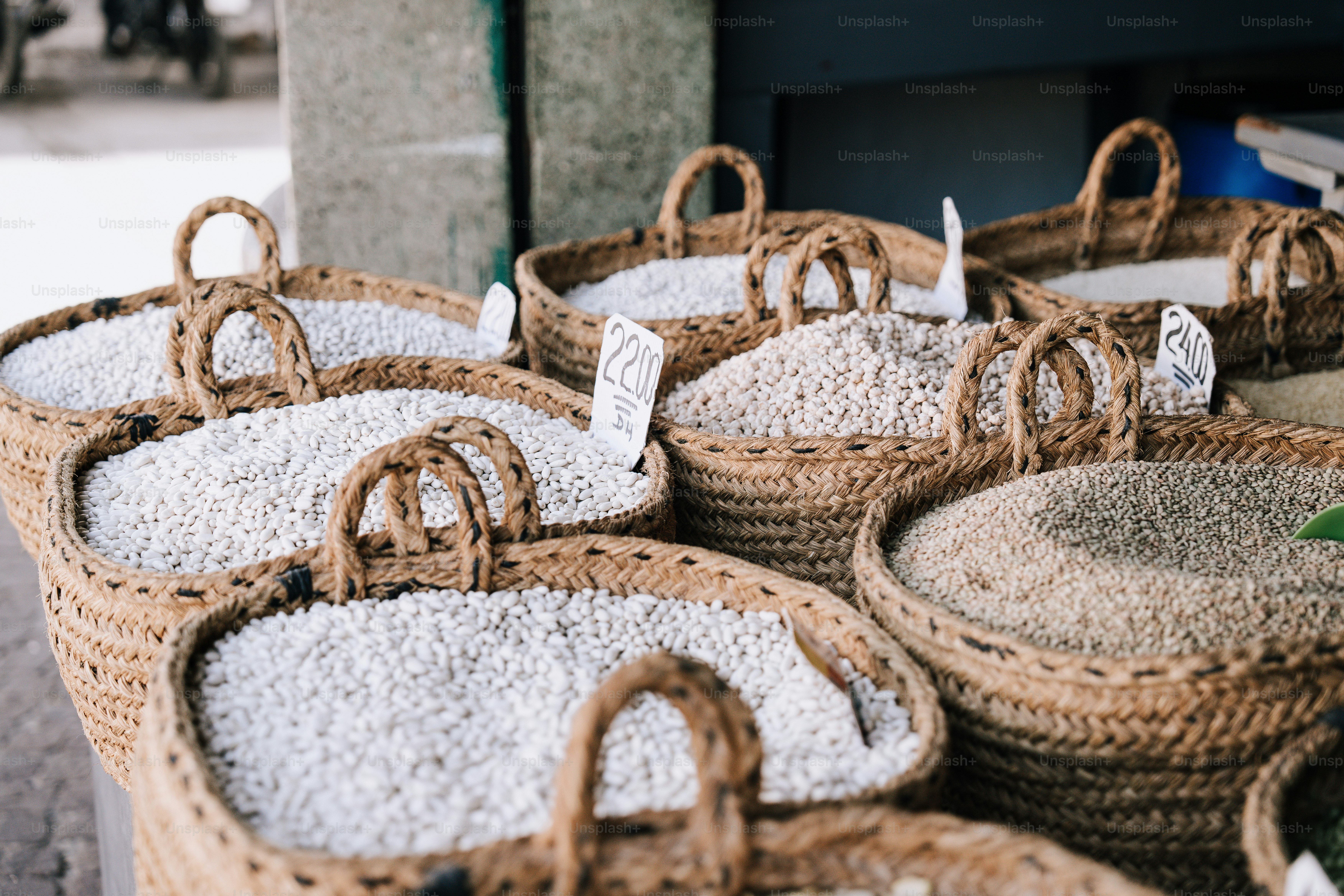 Baskets filled with rice sitting next to each other photo – Market ...