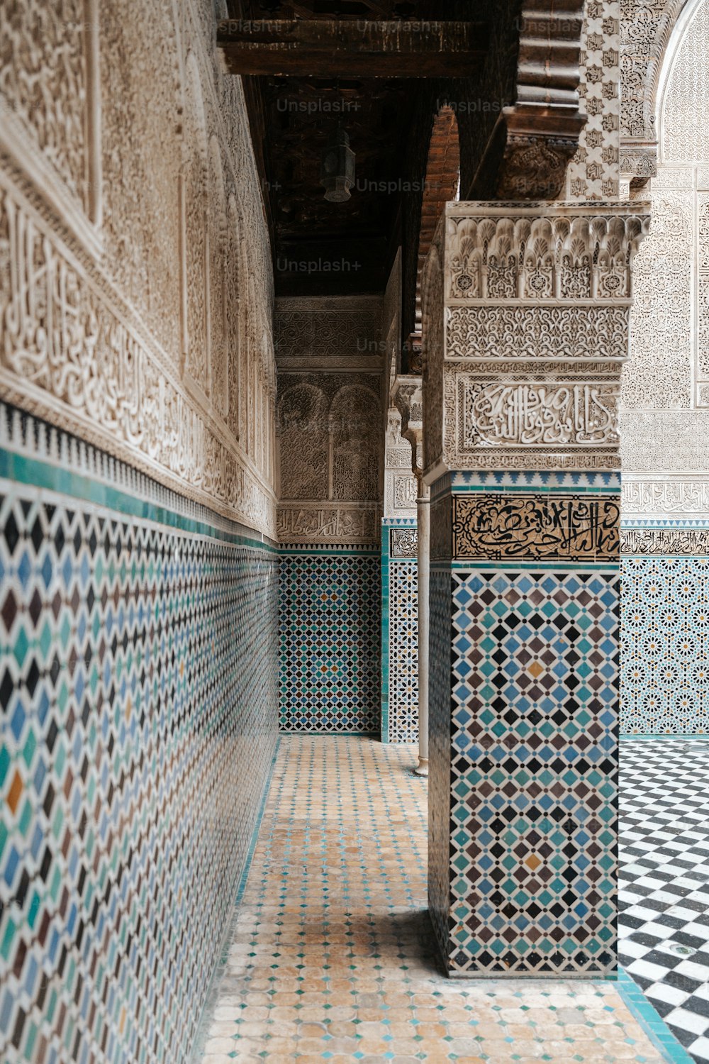 a tiled hallway with blue and white tiles