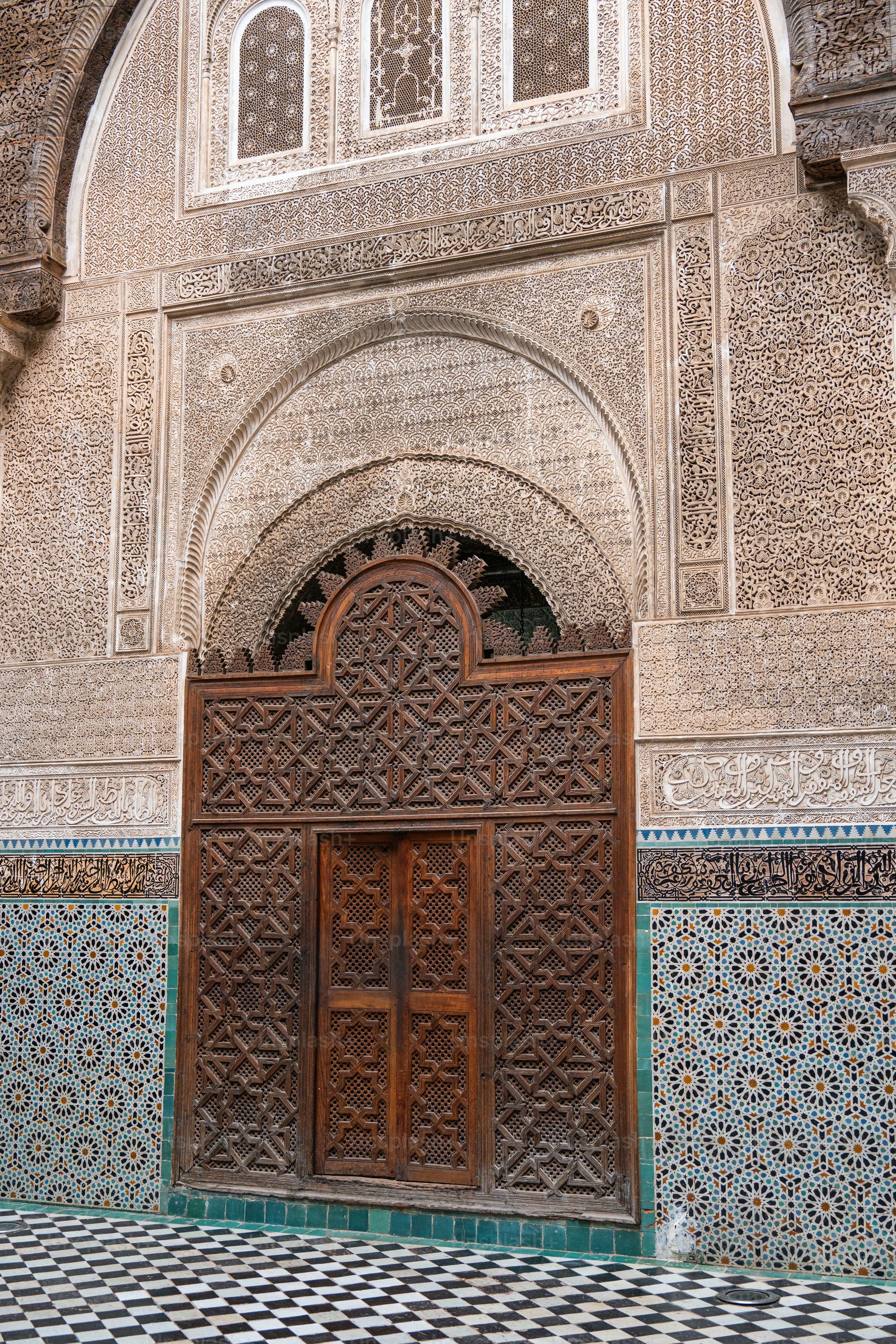 a large wooden door sitting inside of a building