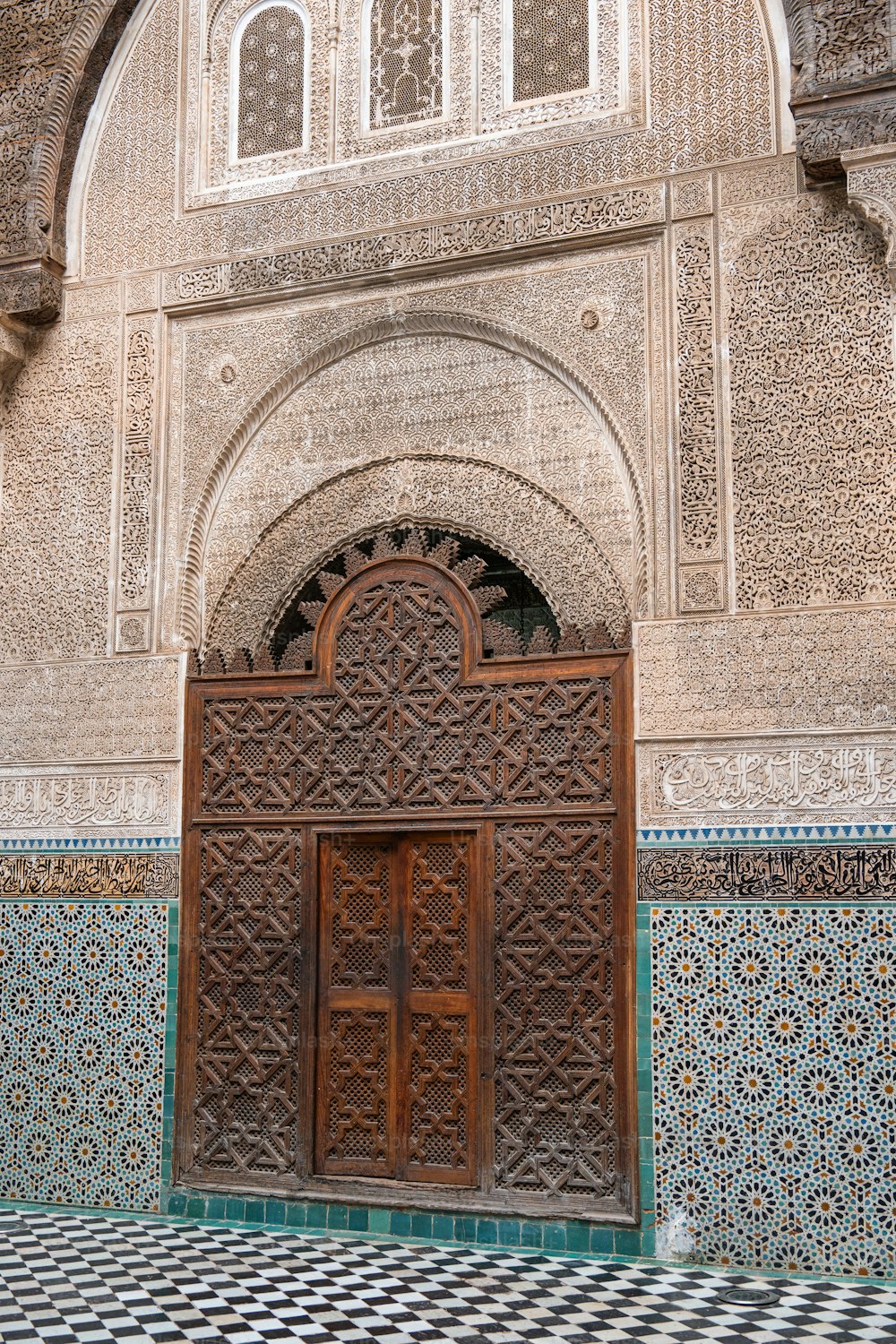 a large wooden door sitting inside of a building