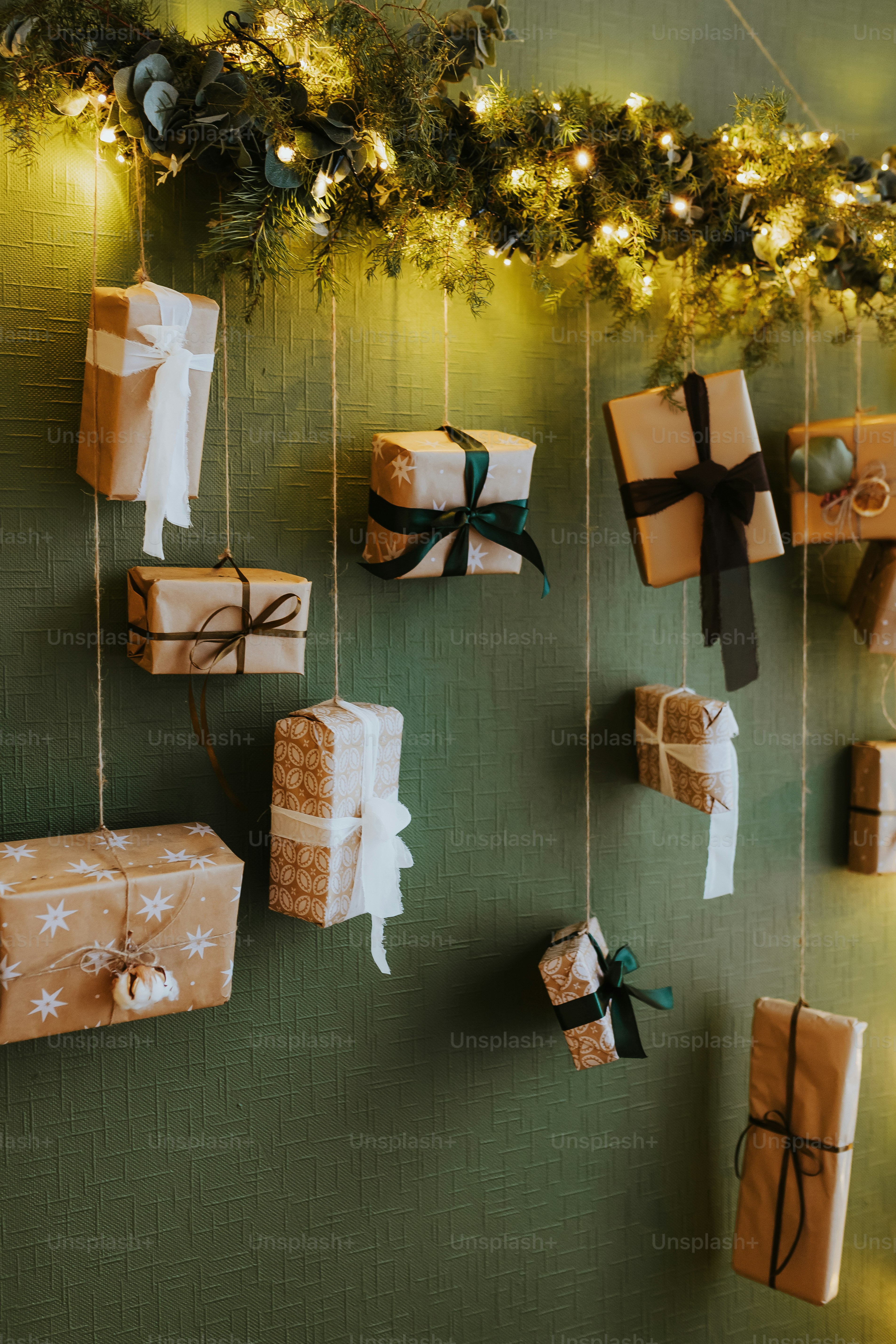 a green wall with presents hanging from it