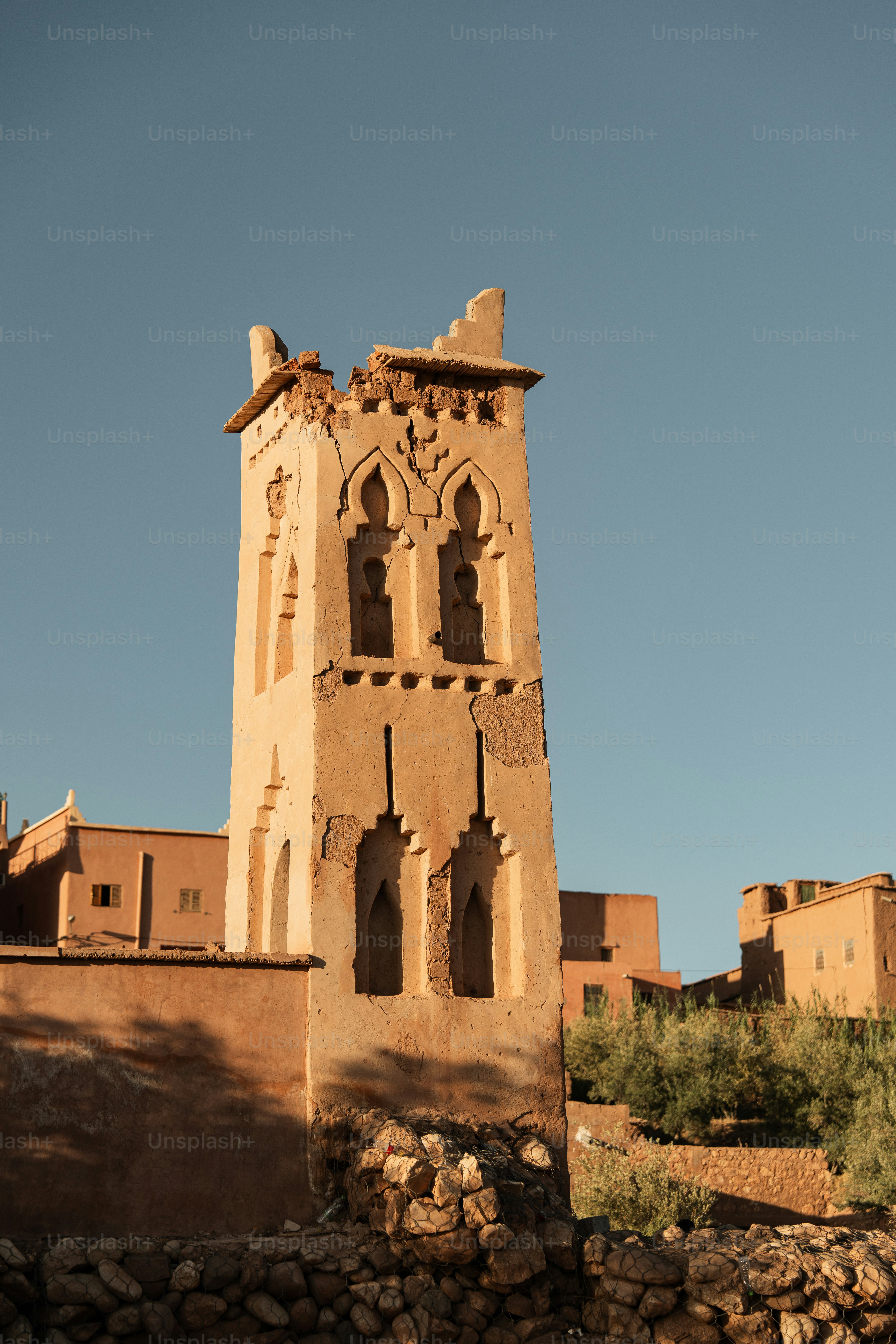 a tall tower with a clock on the top of it
