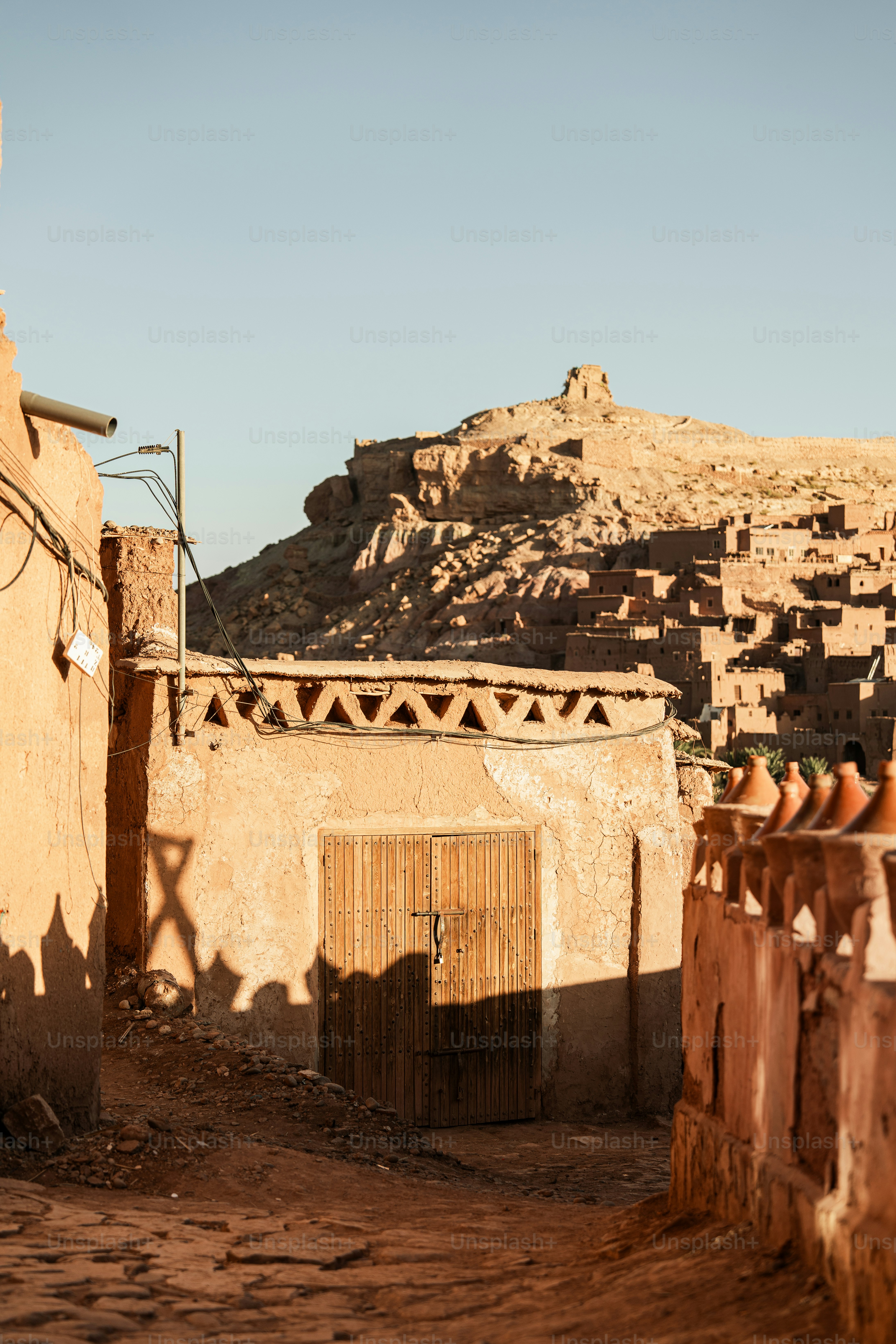 a small village with a mountain in the background