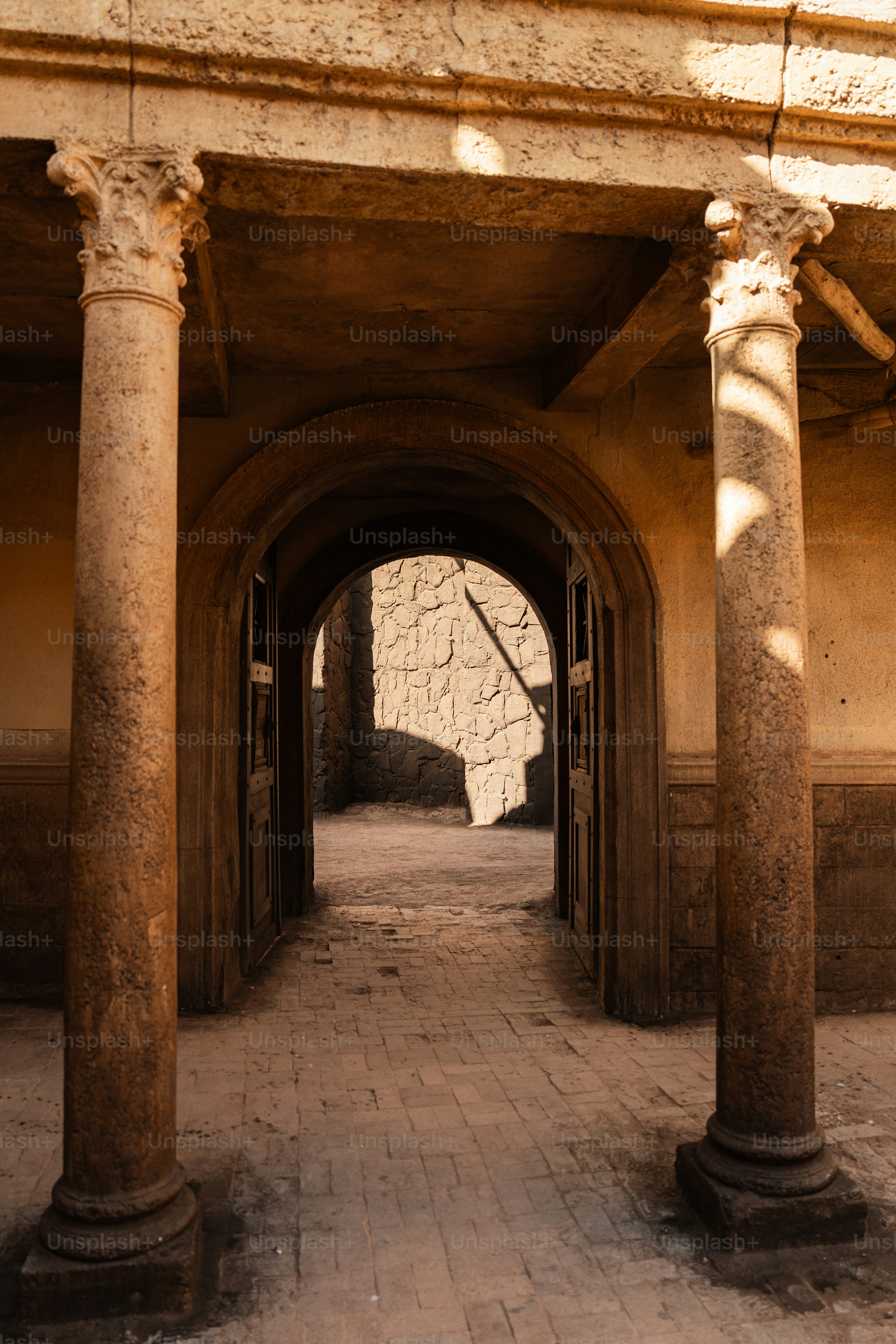 a stone archway leading into a stone building