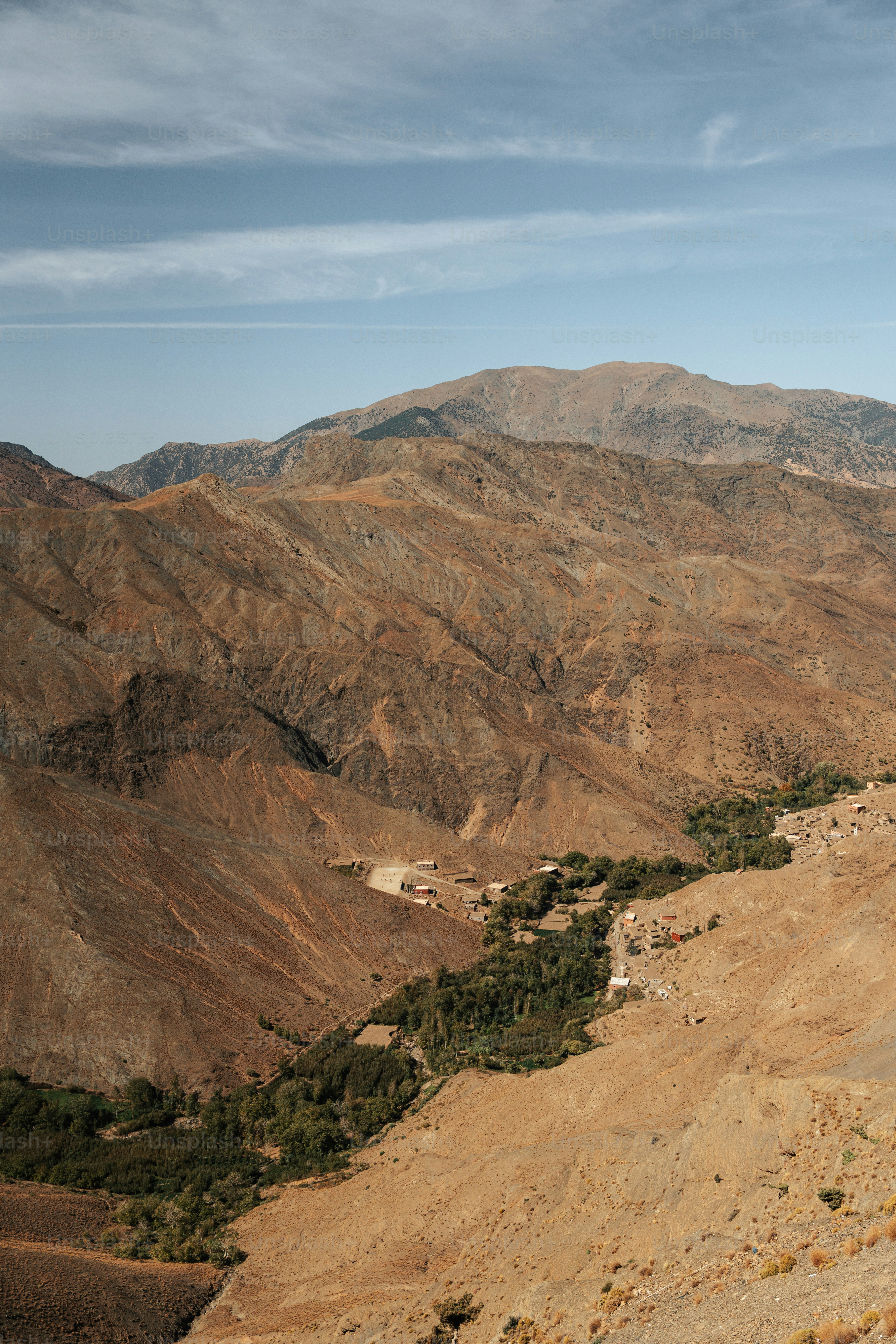 a view of a mountain range with a valley in the foreground